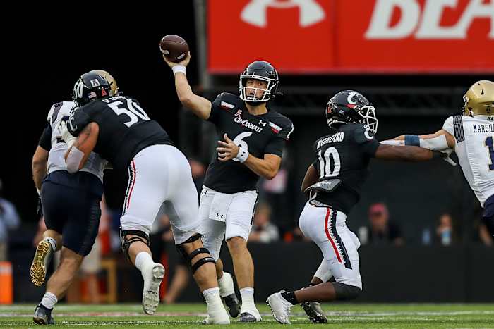 Nov 5, 2022; Cincinnati, Ohio, USA; Cincinnati Bearcats quarterback Ben Bryant (6) throws a pass against the Navy Midshipmen in the first half at Nippert Stadium. Mandatory Credit: Katie Stratman-USA TODAY Sports